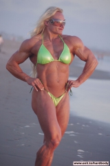 Amazing Muscle Babe posing outdoors