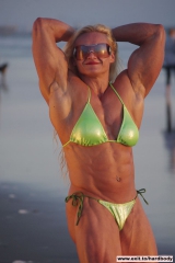 Amazing Muscle Babe posing outdoors