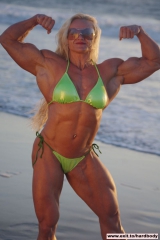 Amazing Muscle Babe posing outdoors