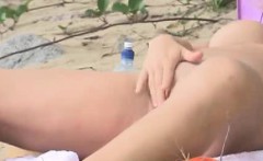 busty girl playing about the beach